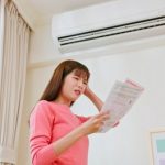 Economic,Inflation,Concept,-,Asian,Woman,Stand,By,Air,Conditioner