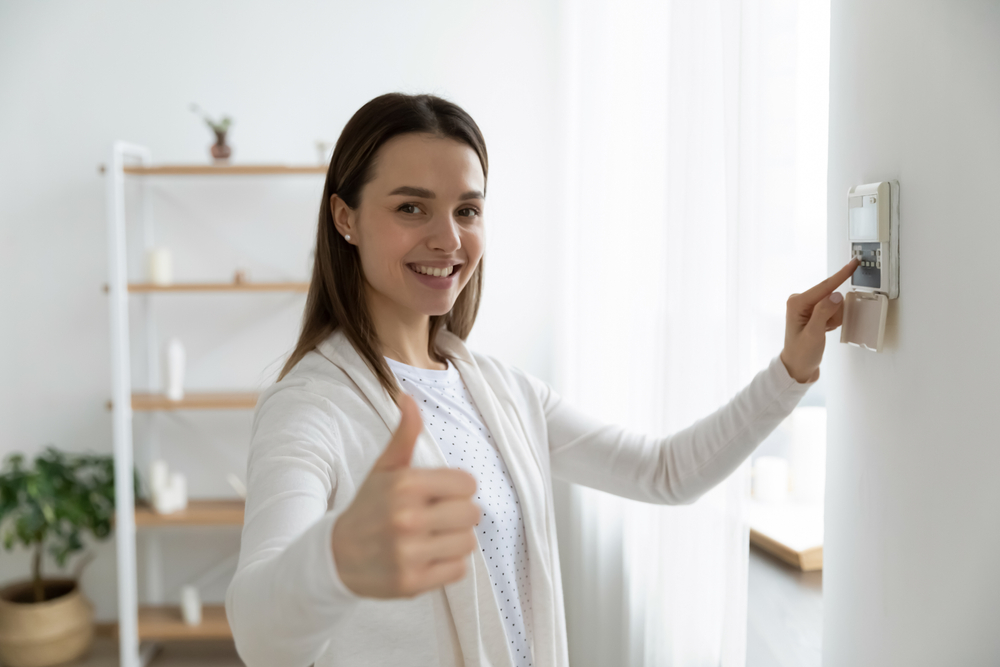 Smiling,Young,Woman,Use,Turn,On,Smart,Home,Control,Panel