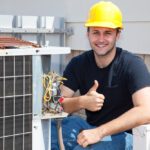 Air,Conditioning,Repairman,Working,On,A,Compressor,And,Giving,A