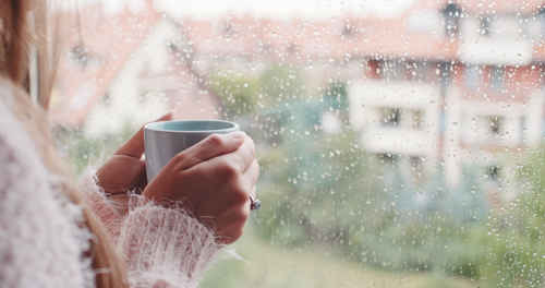 Young,Woman,Enjoying,Her,Morning,Coffee,Or,Tea,,Looking,Out